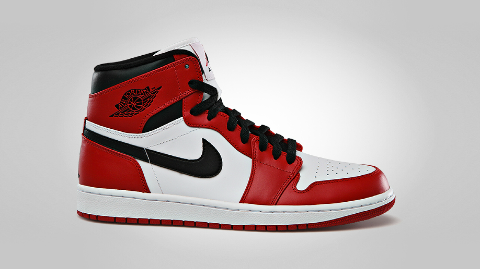 Air Jordan 1 High Chicago, white leather with varsity red overlays and black accents.