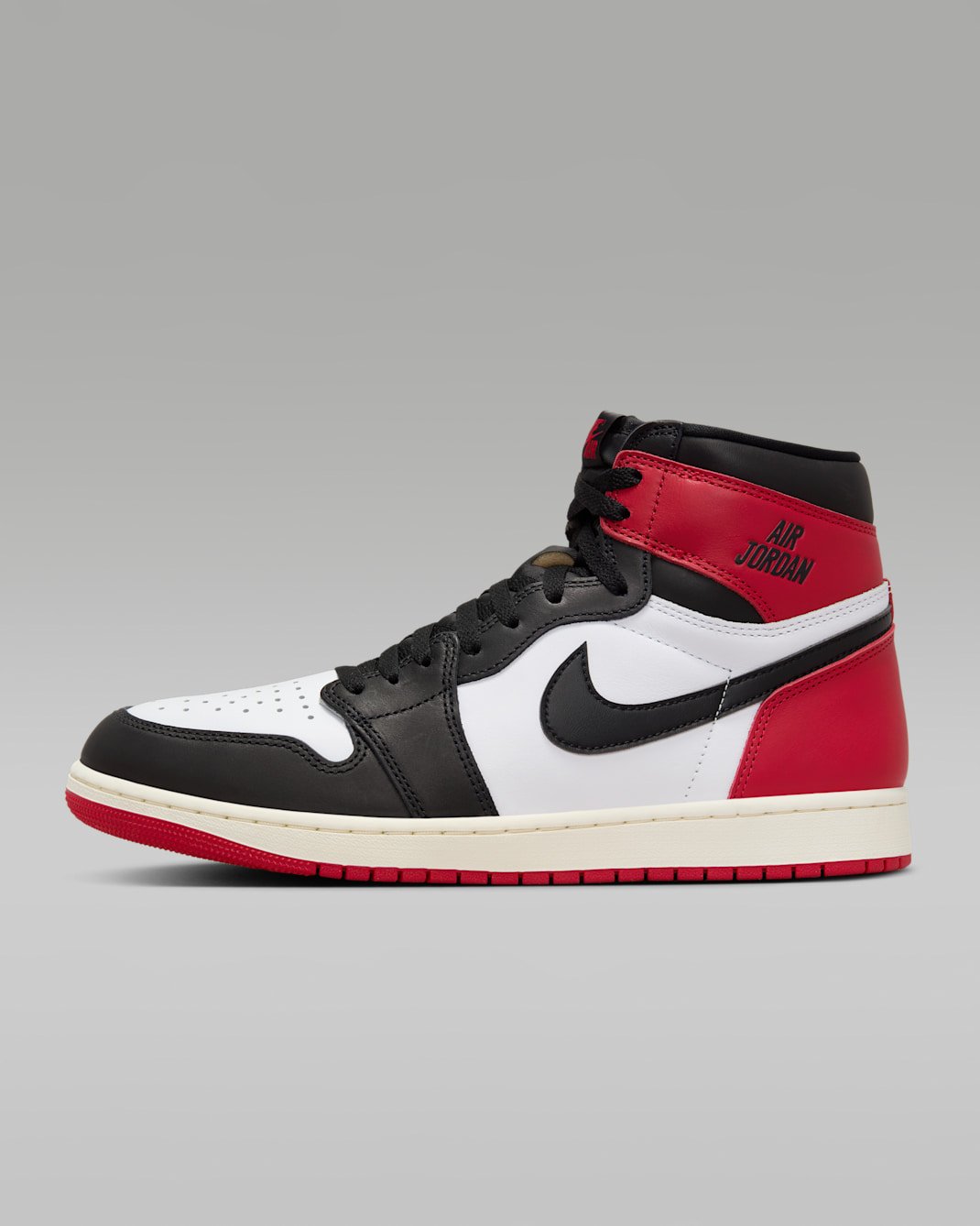Air Jordan 1 High OG Black Toe, white leather with black overlays and red toe and heel.