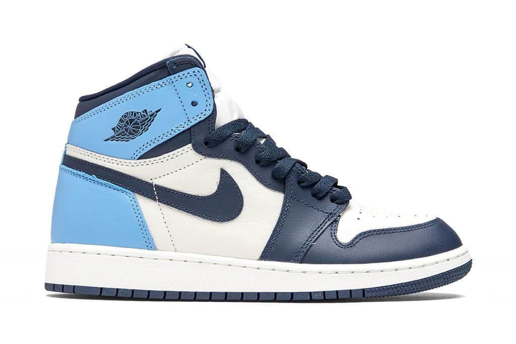 Air Jordan 1 High Obsidian, sail leather base with obsidian navy and university blue accents.