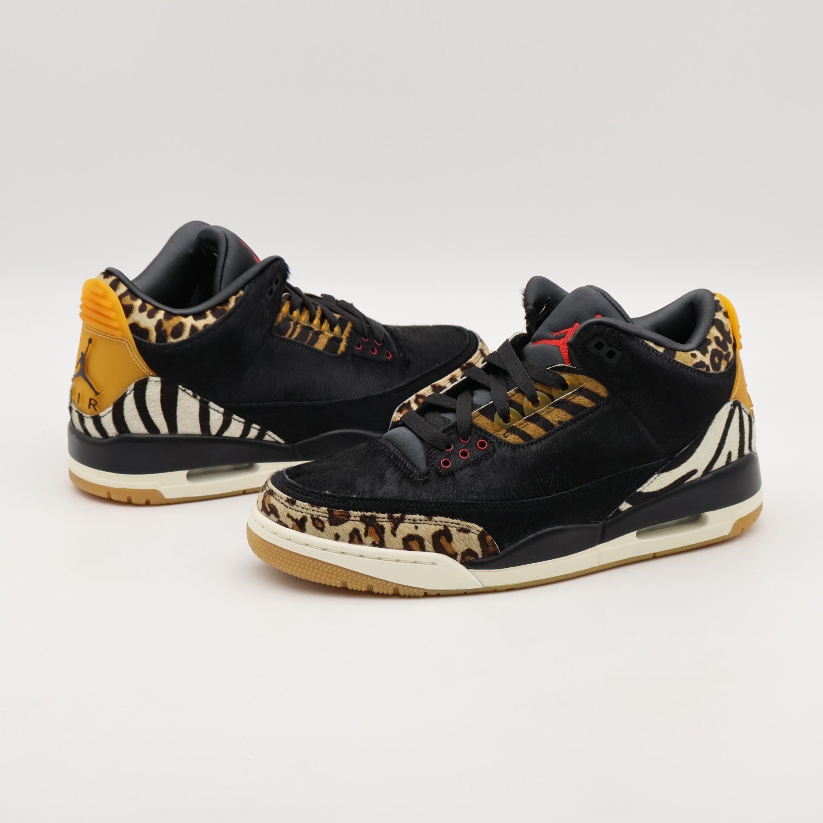 Air Jordan 3 Retro SE Animal Instinct, black upper with leopard and zebra print overlays.
