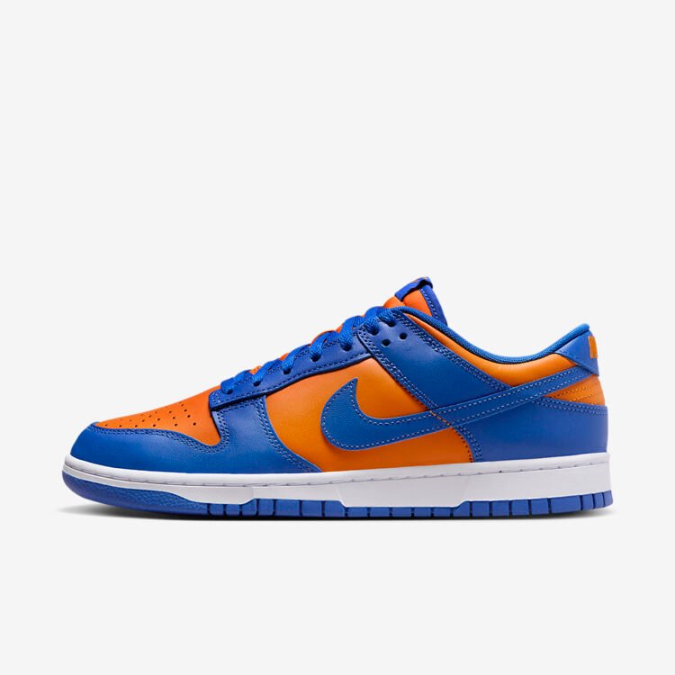 Nike Dunk Low Knicks, vivid orange leather base with royal blue overlays and Swoosh, white midsole and blue outsole