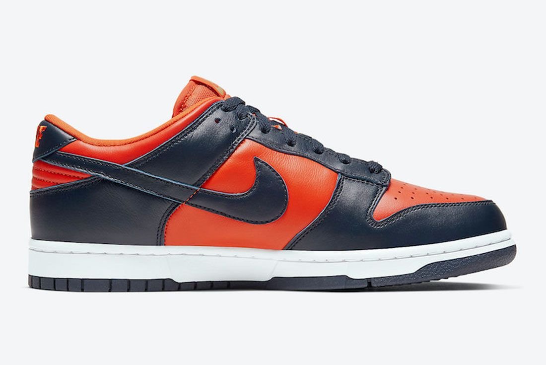 Nike Dunk Low Champ Colors, university orange leather with marine navy overlays and Swoosh, white midsole and navy outsole