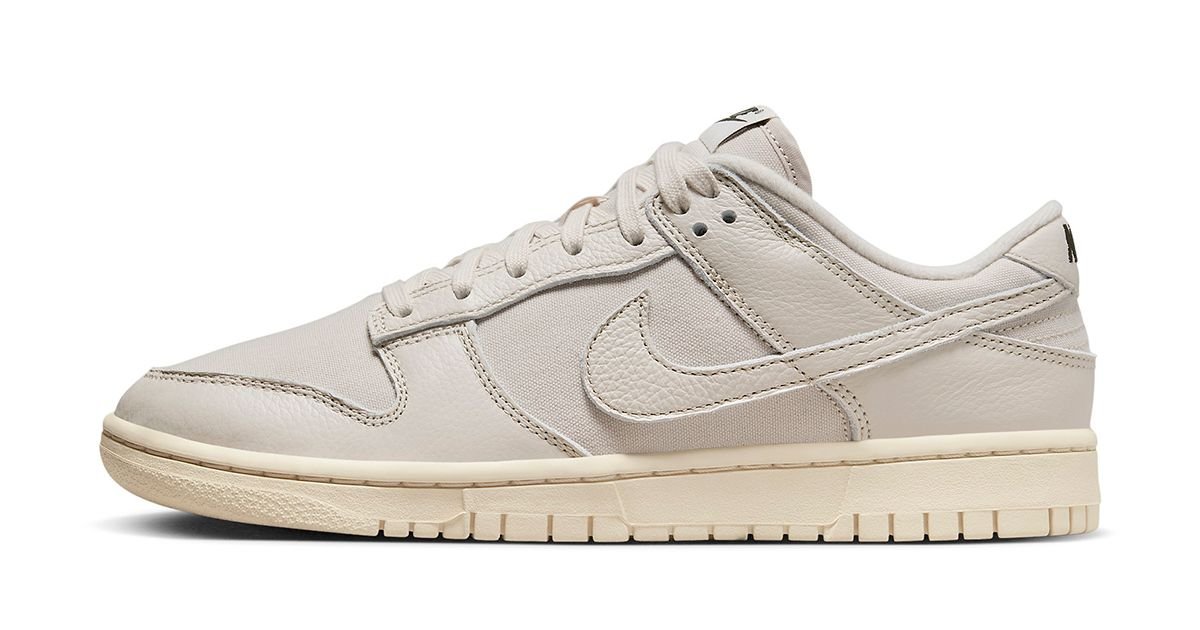 Nike Dunk Low Premium Light Orewood Brown, tonal off-white canvas and leather, cream sole and subtle green branding
