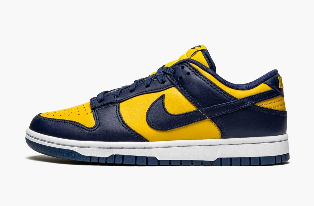 Nike Dunk Low Michigan, maize yellow leather panels with navy overlays and Swoosh, white midsole and navy outsole