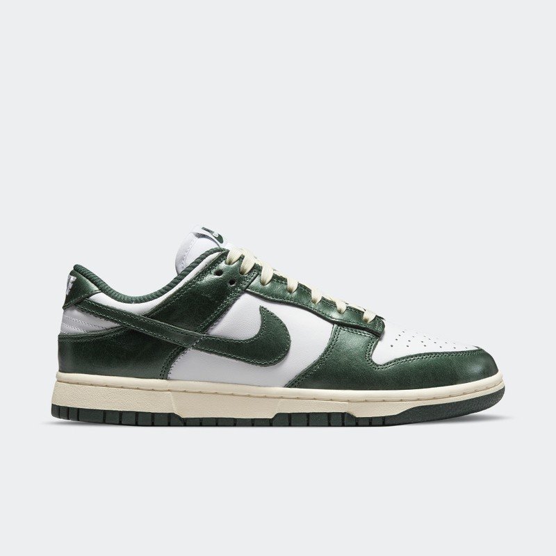 Nike Dunk Low Vintage Green, white leather base with deep glossy green overlays, cream midsole and dark green outsole
